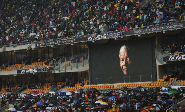 The face of Nelson Mandela is shown on a large billboard in the stands at the memorial service for former South African President Nelson Mandela at the FNB Stadium in the Johannesburg, South Africa township of Soweto on Tuesday. AP The face of Nelson Mandela is shown on a large billboard in the stands at the memorial service for former South African President Nelson Mandela at the FNB Stadium in the Johannesburg, South Africa township of Soweto on Tuesday. AP